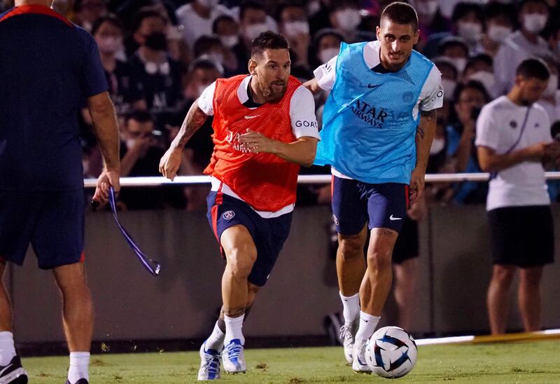 France's Paris Saint-Germain's Lionel Messi (L) dribbles the ball during their training session at a stadium in Tokyo  on July 18, 2022.  (Photo by AFP)