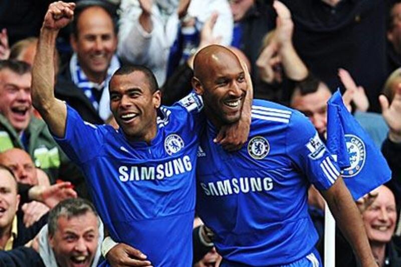 Ashley Cole, left, and  Nicolas Anelka celebrate a goal in the Premier League.