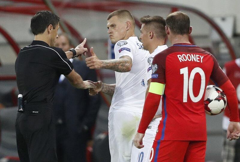Slovakia’s Martin Skrtel is sent off by referee Milorad Mazic during the European World Cup qualifying match. Carl Recine / Action Images / Reuters