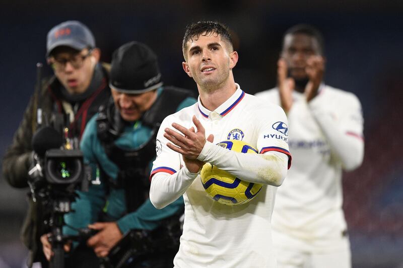 Chelsea's Christian Pulisic with the match ball after scoring a hat-trick against Burnley at Turf Moor. AFP