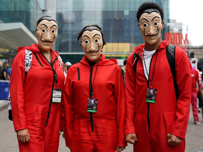 Attendees cosplay as members of 'Money Heist' at New York Comic Con. Timothy A Clary / AFP