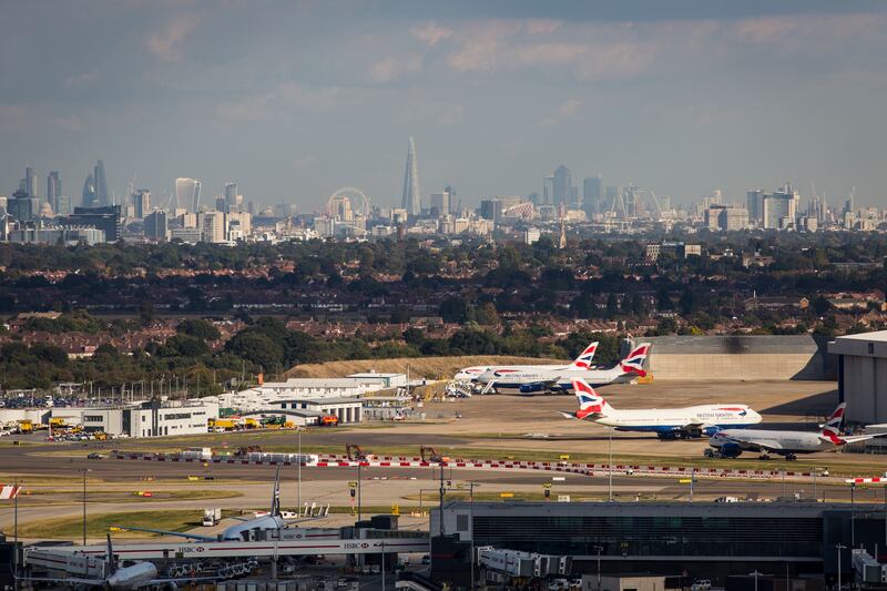 Aircraft at Heathrow Airport in front of the London skyline in 2016