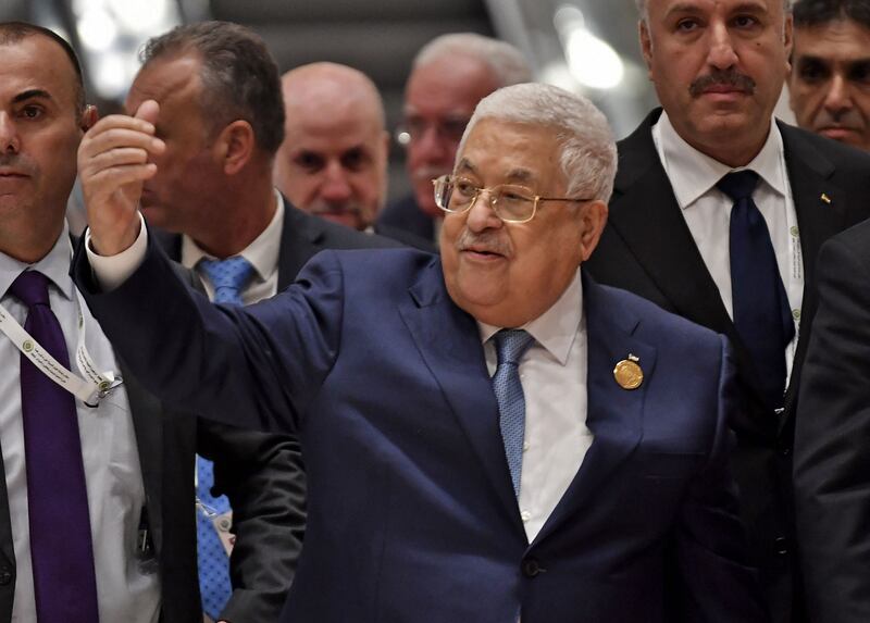 Palestinian President Mahmoud Abbas leaves after the opening ceremony. AFP