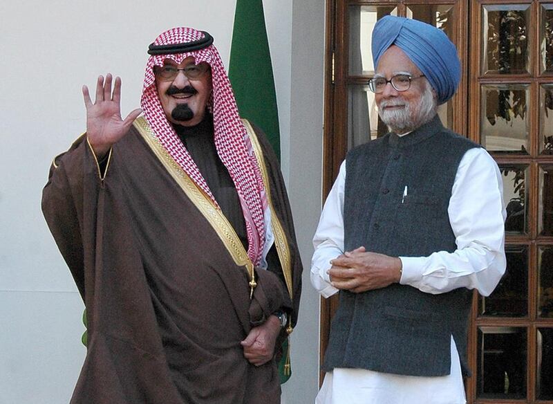 King Abdullah, left, waves to reporters during his meeting with Manmohan Singh, India’s prime minister, in New Delhi, India, on Wednesday, Jan. 25, 2006. Sondeep Shankar / Bloomberg