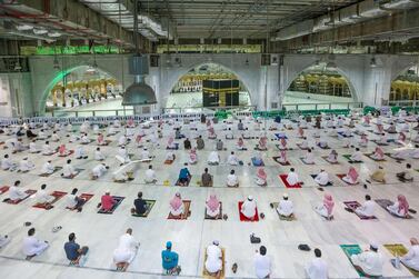 Saudis and residents perform Al Fajr prayers at the Grand Mosque in the holy city of Makkah for the first time after easing months-long Covid-19 restrictions. AFP