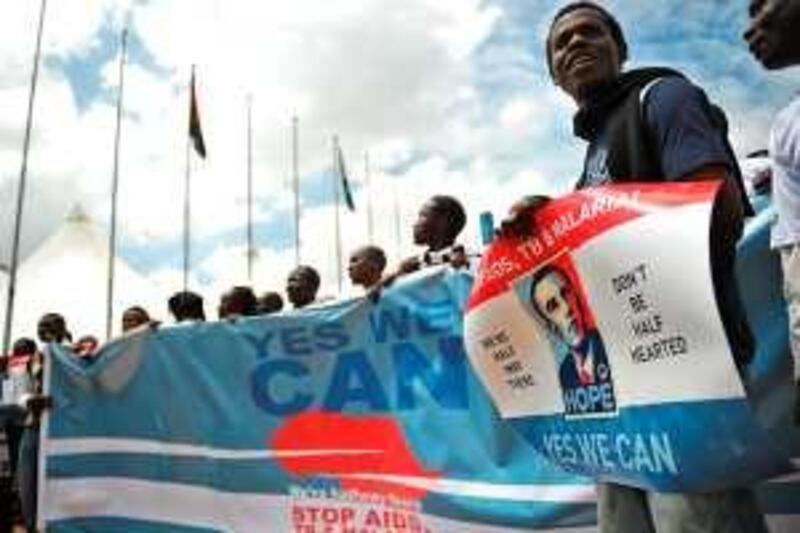 Kenyans hold a procession on November 4, 2009 on the sidelines of the fifth Multilateral Initiative on Malaria conference in the Kenyan capital Nairobi to call for donor support in research and distribution of drugs to combat AIDS, tuberculosis and malaria. Chanting: "Yes We Can," a slogan synonymous to the presidential campaign and election of US President Barack Obama a year ago, partcipants in the procession promised to send thousands of cards and messages to urge donors, and in particular Obama, to continue backing treatment for these diseases by significantly expanding investments in the Global Fund to Fight AIDS, tuberculosis and malaria. AFP PHOTO/Tony KARUMBA *** Local Caption ***  170963-01-08.jpg *** Local Caption ***  170963-01-08.jpg
