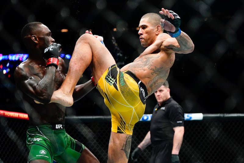 Alex Pereira kicks Israel Adesanya during the first round of their middleweight title bout at UFC 281 on November 13, 2022 in New York. AP