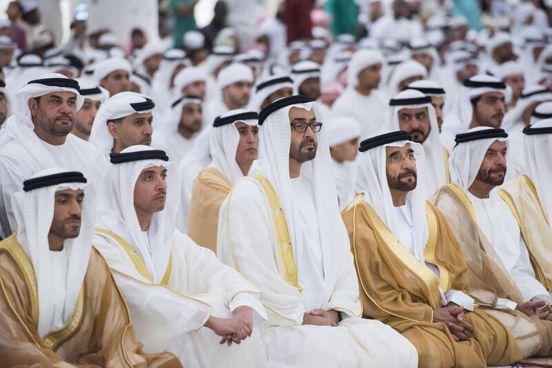 Sheikh Mohammed bin Zayed, Crown Prince of Abu Dhabi and Deputy Supreme Commander of the UAE Armed Forces, centre, attends Eid Al Fitr prayers at the Sheikh Zayed Grand Mosque with Sheikh Nahyan bin Zayed, Chairman of the Board of Trustees of Zayed bin Sultan Al Nahyan Charitable and Humanitarian Foundation, left, Sheikh Hazza bin Zayed, Security Advisor for the UAE and Vice Chairman of the Abu Dhabi Executive Council, second left, Sheikh Saif bin Mohammed, right, and Sheikh Suroor bin Mohammed, right. Rashed Al Mansoori / Crown Prince Court - Abu Dhabi