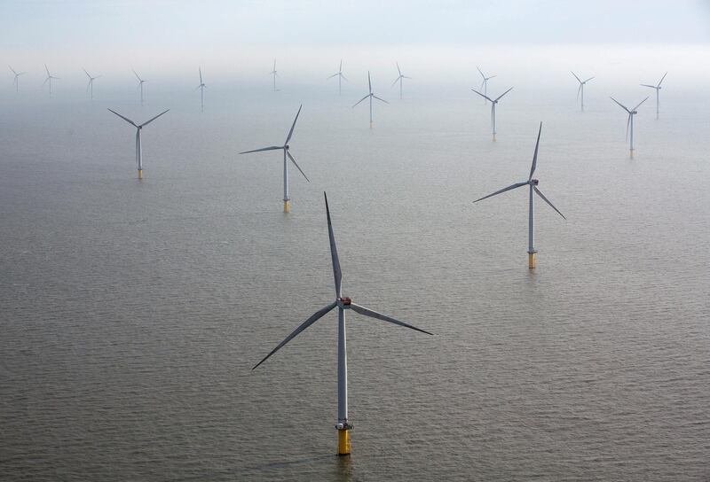 Wind turbines sit in the North Sea at the London Array offshore wind farm, a partnership between Dong Energy A/S, E.ON AG and Abu Dhabi-based Masdar, in the Thames Estuary, U.K., on Tuesday, Oct. 27, 2015. The London Array, east of London, has 175 Siemens turbines and a capacity of 630MW. Photographer: Simon Dawson/Bloomberg