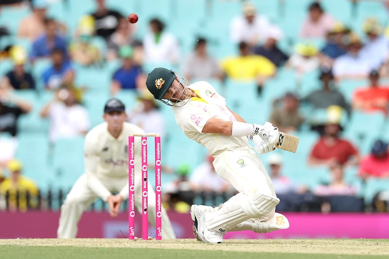 David Warner of Australia avoids a bounce. Getty Images