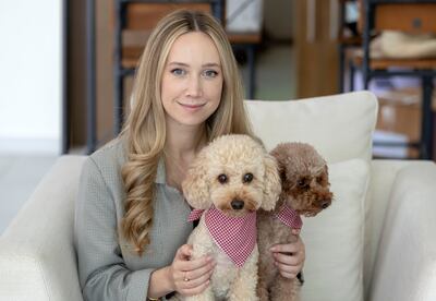 Alyssa Mariano, with toy poodles Winston and Hudson, has an emergency savings fund. Chris Whiteoak / The National
