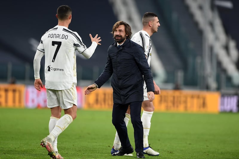 Juventus manager Andrea Pirlo celebrates with Cristiano Ronaldo after their goalless draw with Inter Milan sealed a 2-1 aggregate victory in the Coppa Italia semi-final on January 9. Getty