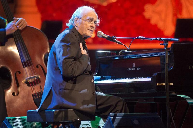 Veteran composer, pianist and bandleader Michel Legrand will celebrate his 85th birthday with a performance at Dubai Opera on Thursday. Jordi Vidal / Redferns / Getty Images.