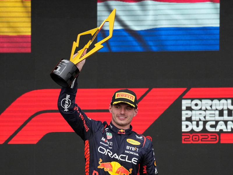 Formula One F1 - Canadian Grand Prix - Circuit Gilles Villeneuve, Montreal, Canada - June 18, 2023 Red Bull's Max Verstappen celebrates with a trophy on the podium after winning the race. Reuters