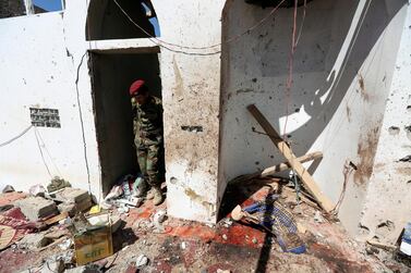 A soldier stands at the site of a Houthi missile attack on a military camp’s mosque in Marib, Yemen January 20, 2020. Reuters