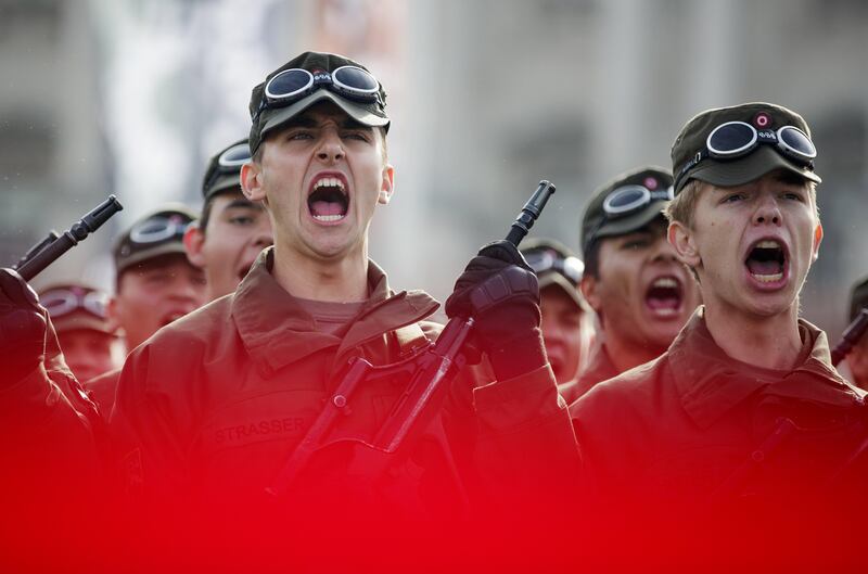 Recruits of the Austrian armed forces scream during the swearing-in ceremony on Austrian National Day (Nationalfeiertag) on Heldenplatz square in Vienna, Austria.  Lisi Niesner / EPA