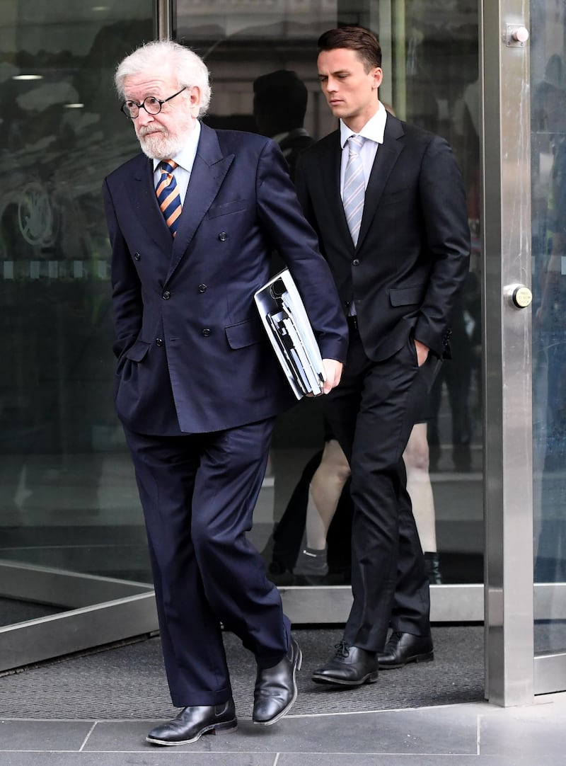 Robert Richter QC, the barrister representing Cardinal George Pell, is seen leaving Melbourne's County Court in Melbourne on May 2, 2018. 
Top Pope aide Pell could face two separate trials as he fights to clear his name over historic sexual offences, an Australian court heard. / AFP PHOTO / Mal Fairclough