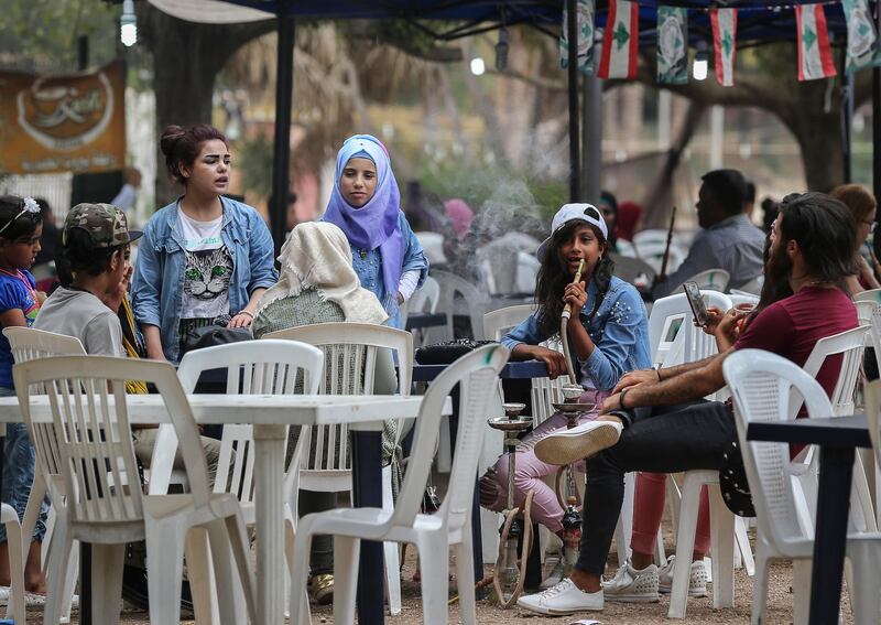 epa06962796 People sit at popular amusement park 'Horsh Beirut' to celebrate Eid Al-Adha in Beirut, Lebanon, 21 August 2018. Eid al-Adha is the holiest of the two Muslims holidays celebrated each year, it marks the yearly Muslim pilgrimage (Hajj) to visit Mecca, the holiest place in Islam. Muslims slaughter a sacrificial animal and split the meat into three parts, one for the family, one for friends and relatives, and one for the poor and needy.  EPA-EFE/NABIL MOUNZER *** Local Caption *** 54566967