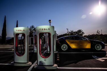 A Tesla Inc Model S electric taxi vehicle charges at a Supercharger station in Sant Cugat, Spain, last year. Bloomberg