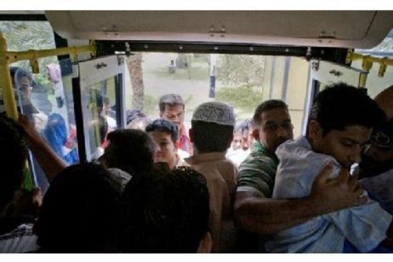Rude or not rude? Men cram into a city bus in Abu Dhabi. Jaime Puebla / The National