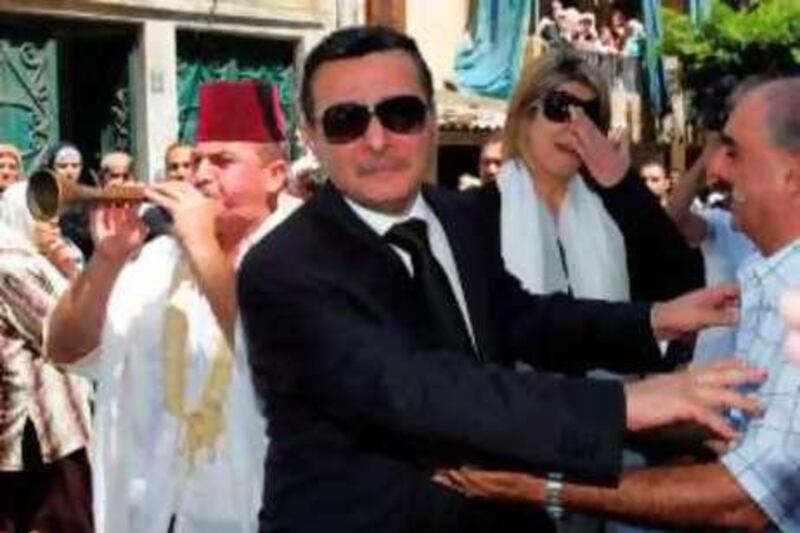 Abdulsattar (C), father of slain Lebanese singer Suzanne Tamim, mourns during her funeral in Beirut on August 4, 2008. Tamim was found dead in the Gulf emirate of Dubai on July 28, 2008. No further details about the cause of death were released. AFP PHOTO/ANWAR AMRO