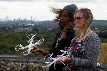 Heathrow Pause activists with the drones they plan to fly. Reuters