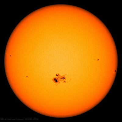 Sunspots – areas of particularly strong magnetic forces that appear darker than their surroundings – thrown out during the solar maximum can be bigger than Earth. NASA