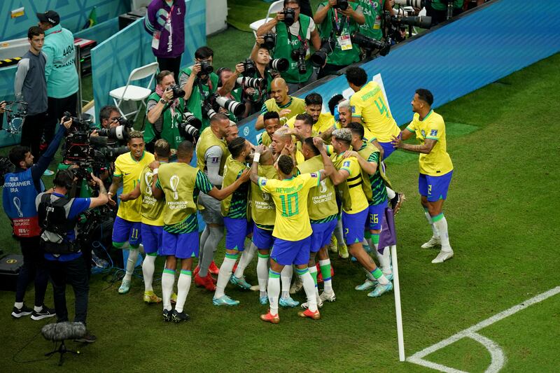 Brazil and Richarlison celebrate the second goal. PA