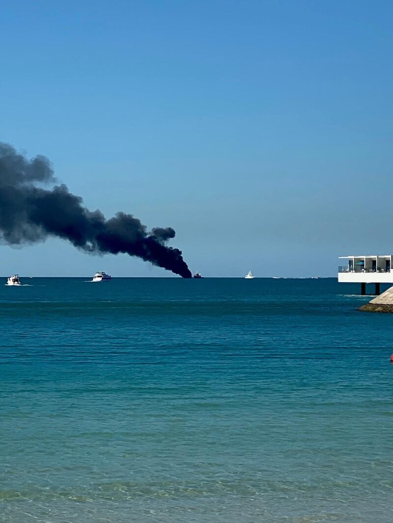 A vessel on fire off the coast of Dubai, near Burj Al Arab. Farah Andrews / The National