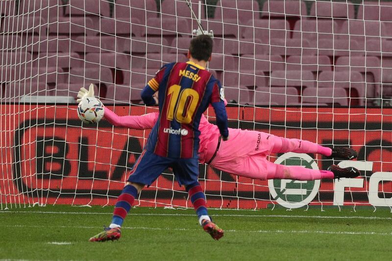 Lionel Messi misses a penalty against Valencia at the start of the move that led to his record-equalling goal. Reuters