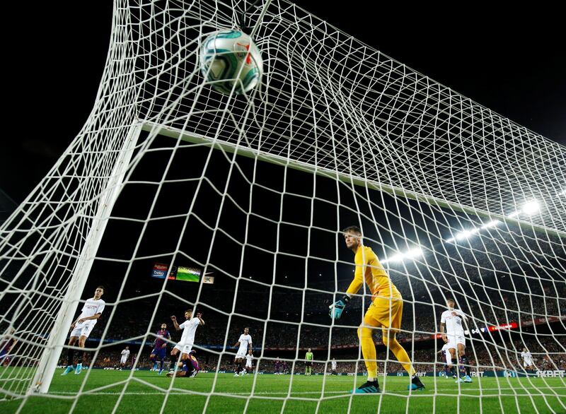 The Sevilla keeper watches Suarez's shot fly into the net. Reuters