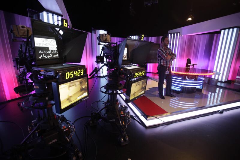 April 12, 2012 (Abu Dhabi) Zaidoon Mohammed a Floor Manager  for Sky News in Abu Dhabi watches while news presenters are on air in Abu Dhabi April 12, 2012. Sky News is set to launch its Arabic News Service May 6, 2012. (Sammy Dallal / The National)
     Sky News Arabia