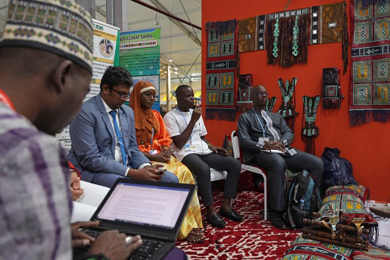 Conference participants attend a panel discussion at the Niger pavilion at Cop27.  Getty Images
