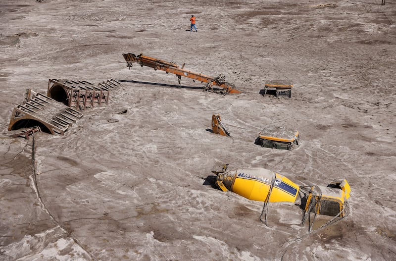 Construction vehicles covered in debris caused by floods after a lake burst in Rangpo, Sikkim state, India. Reuters