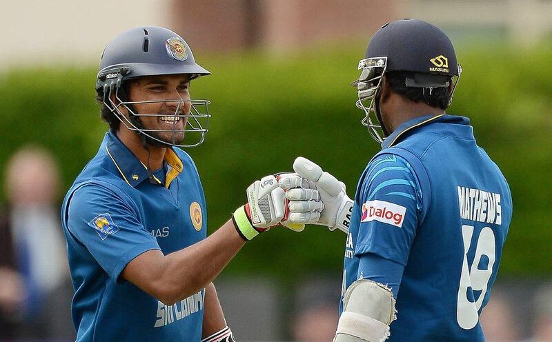 Sri Lanka cricket players Dinesh Chandimal, left, and captain Angelo Mathews celebrate during their ODI win over Ireland on Tuesday. Artur Widak / AFP / May 6, 2014 