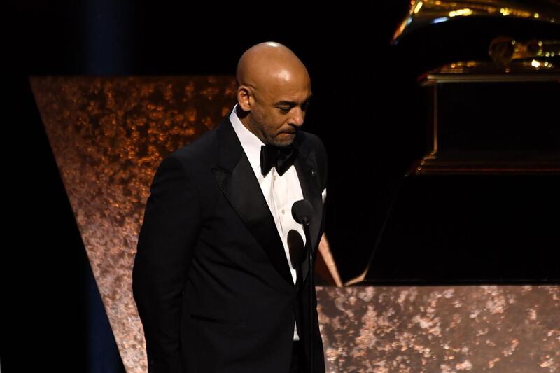 Interim president of The Recording Academy Harvey Mason Jr. holds a moment of silence for late NBA legend Kobe Bryant onstage during the 62nd Annual Grammy Awards pre-telecast show on January 26, 2020, in Los Angeles. AFP