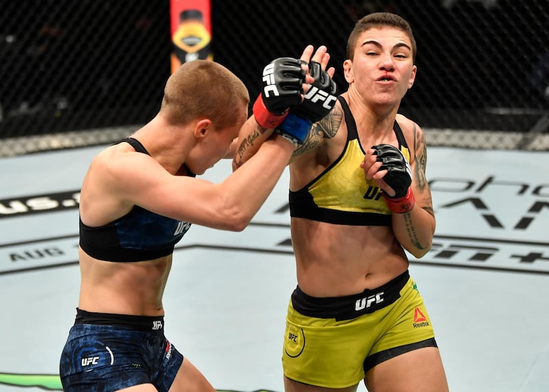 ABU DHABI, UNITED ARAB EMIRATES - JULY 12: In this handout image provided by UFC, (R-L) Jessica Andrade of Brazil punches Rose Namajunas in their strawweight fight during the UFC 251 event at Flash Forum on UFC Fight Island on July 12, 2020 on Yas Island, Abu Dhabi, United Arab Emirates. (Photo by Jeff Bottari/Zuffa LLC via Getty Images)