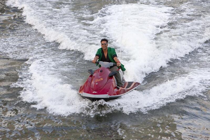 Akshay Kumar arrives via jet ski to a yacht specially chartered for the press conference launch of his new movie release titled BOSS. Antonie Robertson / The National 
