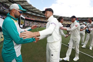 England Captain Joe Root ( Right ) shakes hands with Nathan Lyon during day four of the first Ashes test at The Gabba, Brisbane.