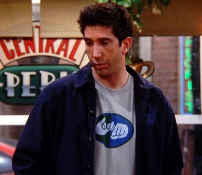 Ross in the T-shirt with the sign language symbol for 'friends' on the front. Courtesy: Warner Bros.