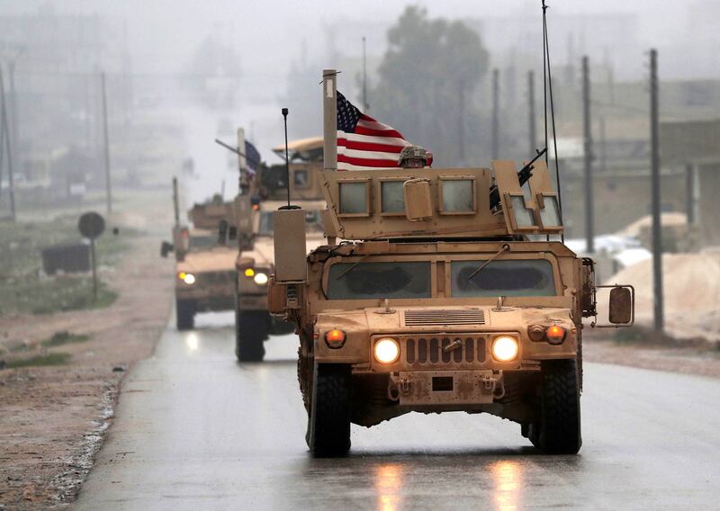 A picture taken on December 30, 2018, shows a line of US military vehicles in Syria's northern city of Manbij.  President Donald Trump announced last week that US troops would depart from Syria, leaving Manbij residents dreading a long-threatened attack by Turkey.  / AFP / Delil SOULEIMAN
