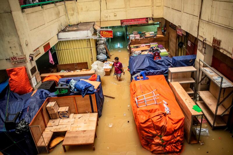 A man walks in an area hit by floods in Jakarta, Indonesia.  Reuters