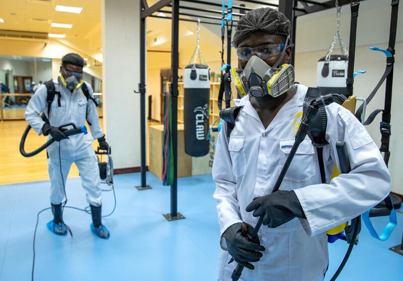 Abu Dhabi, United Arab Emirates, July 1, 2020.   Sanitation workers at Haddins Fitness, Zayed Sports City.
Victor Besa  / The National
Section:  NA 
Reporter:  Haneen Dajani