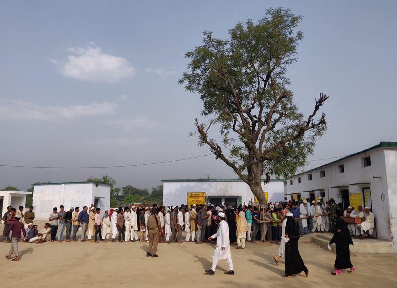 Voters line up to cast their votes outside a polling station in Muzaffarnagar, Uttar Pradesh. Reuters