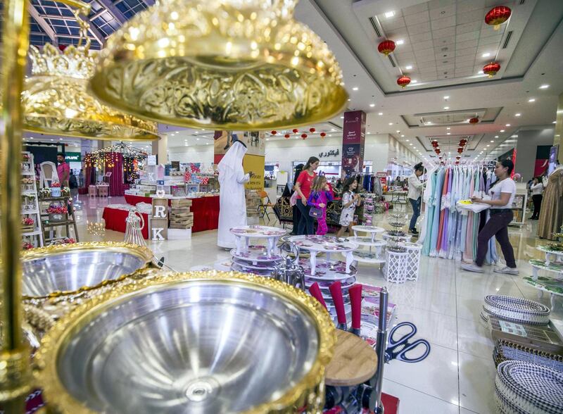 DUBAI, UNITED ARAB EMIRATES, 04 May 2018 - Shoppers checking out items at Ramadan Market, Dragon Mart 2.  Leslie Pableo for The National for Ellen Fortini's story