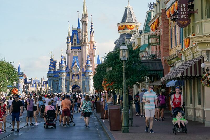 Guests at Walt Disney World in Florida. Disney’s parks division generated $2.45bn in operating income, compared with a loss a year earlier. The company also added more subscribers to its Disney+ streaming service than analysts expected. AP