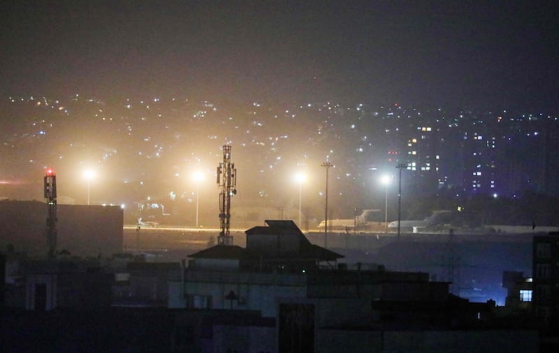 Planes are seen on the tarmac at the airport in Kabul late on August 30, 2021, hours ahead of a US deadline to complete its frenzied withdrawal from Afghanistan. AFP