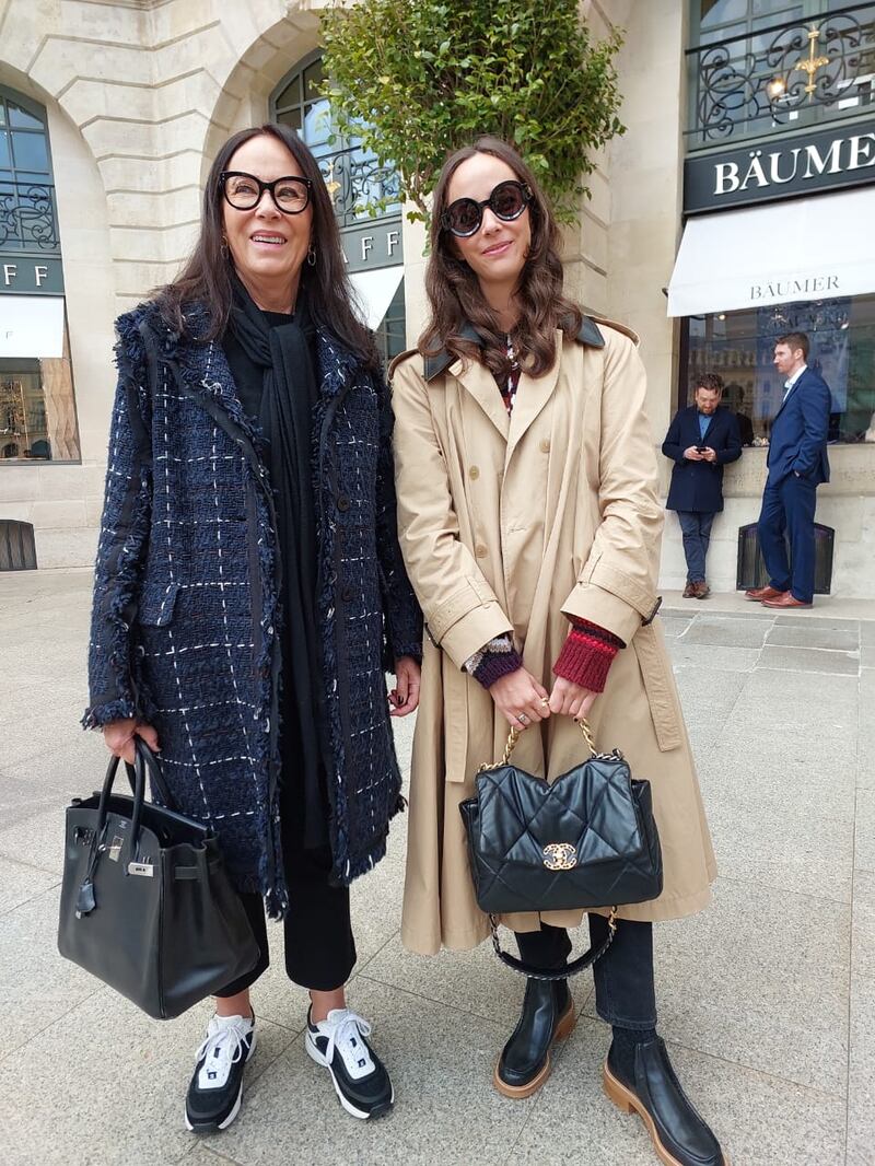 A stylish mother and daughter next to the Ritz Hotel.