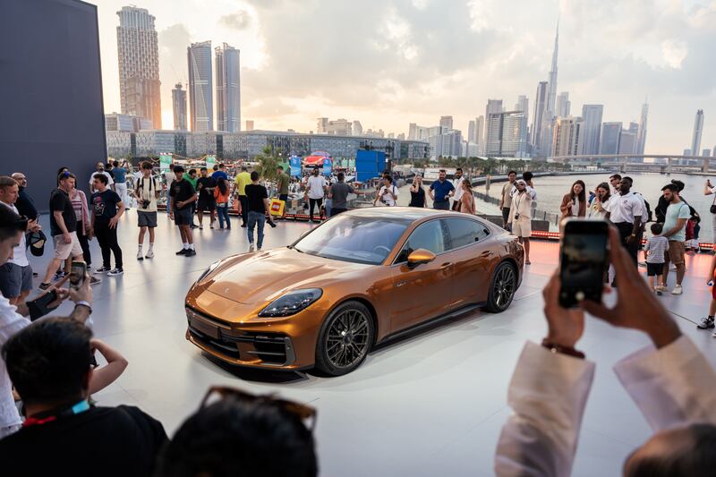 Attendees at Icons of Porsche get shots of the 2024 Panamera. All photos: Porsche