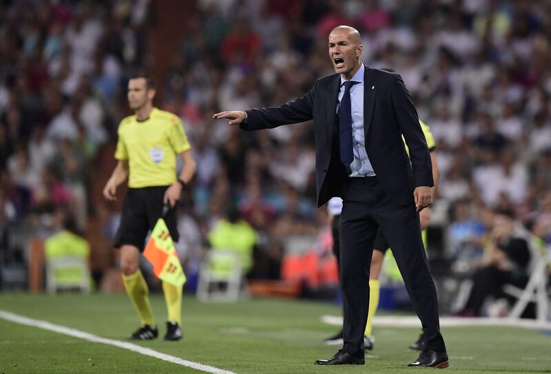 Real Madrid's French coach Zinedine Zidane gestures on the sideline during the second leg of the Spanish Supercup football match Real Madrid vs FC Barcelona at the Santiago Bernabeu stadium in Madrid, on August 16, 2017. / AFP PHOTO / JAVIER SORIANO